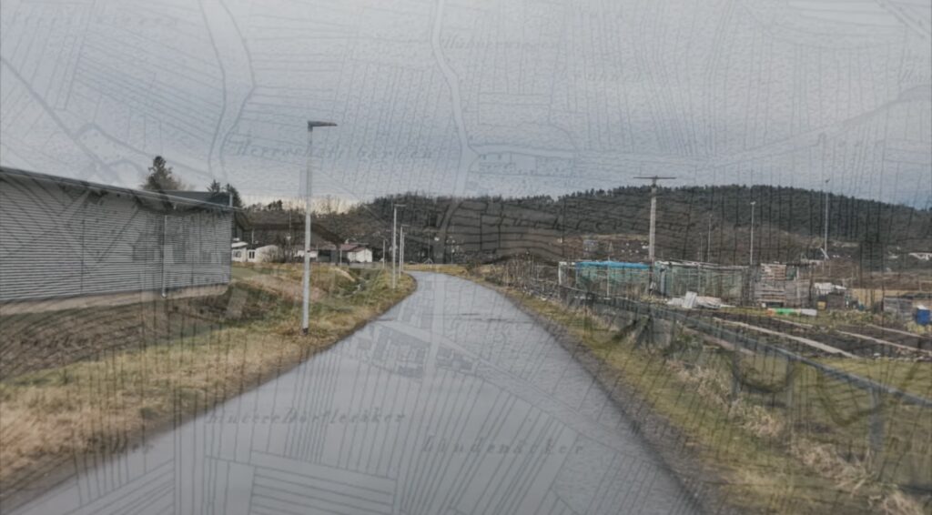 A translucent old-fashioned map of a small area in South Germany, overlaid on the image of a single-lane road receding into the distance.