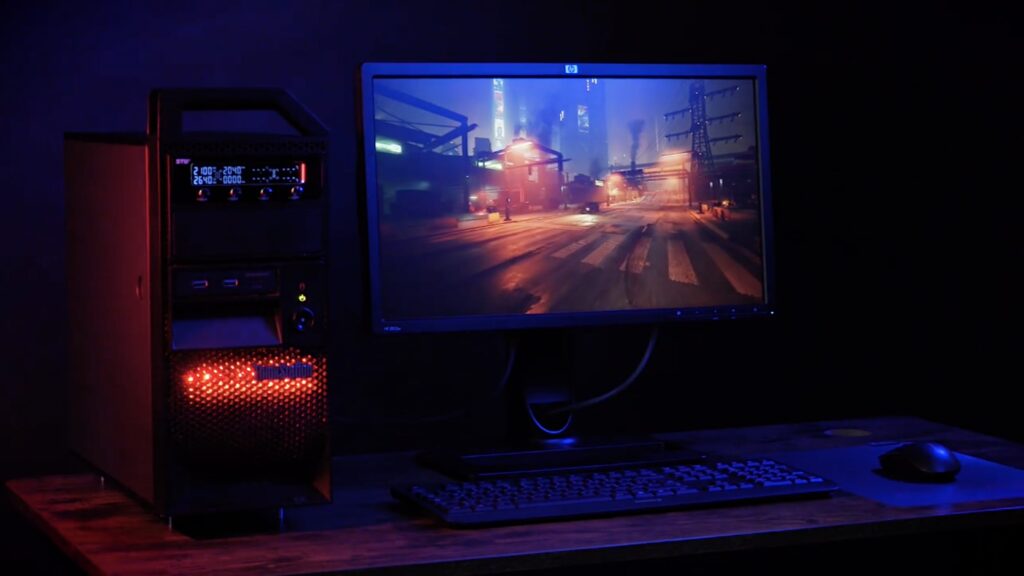 An IBM ThinkStation with an LCD monitor displaying a moody street scene in the game Cyberpunk 2077.
