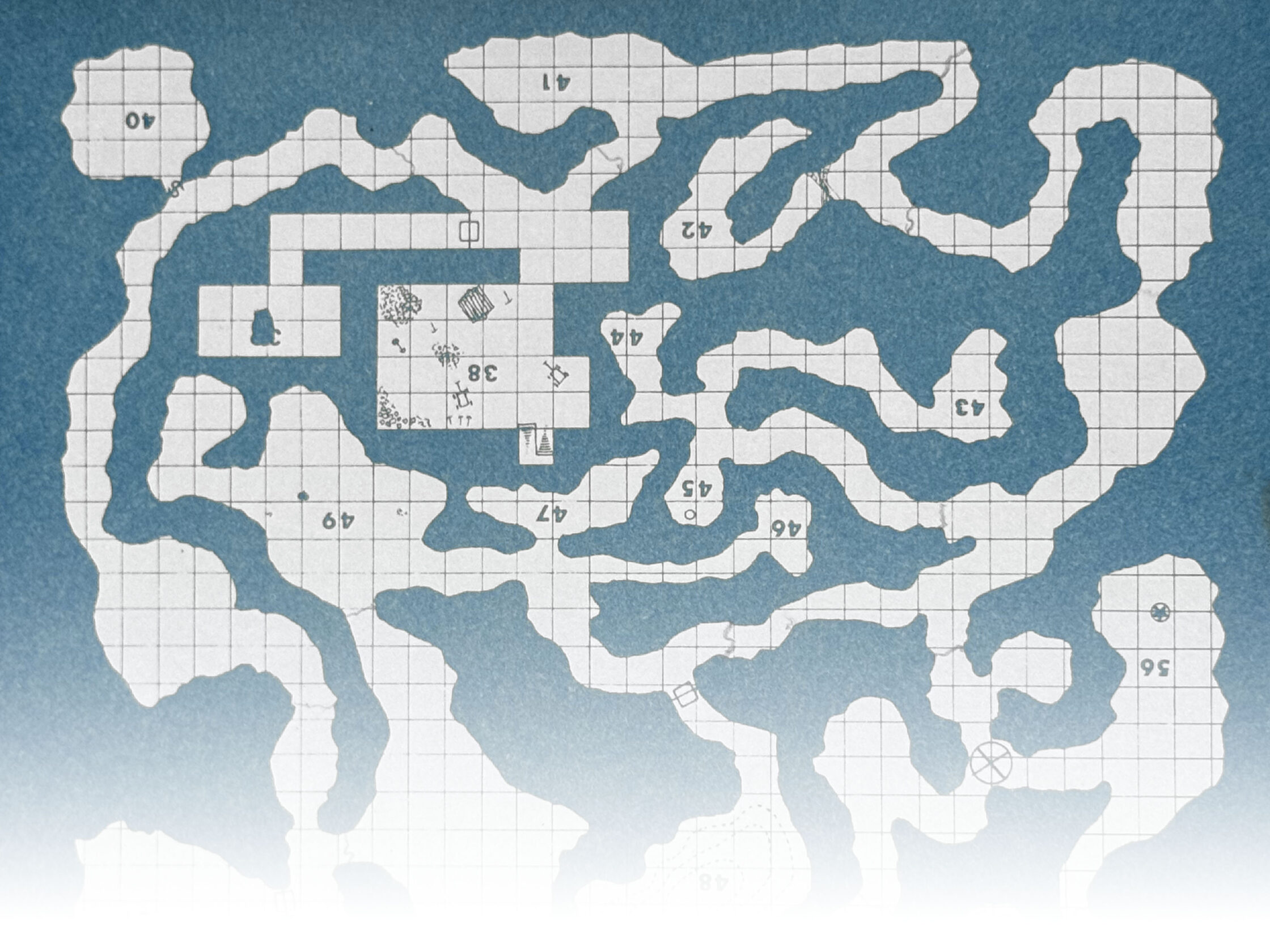 A blue map of a cave system from the inside cover of a TSR adventure booklet.
